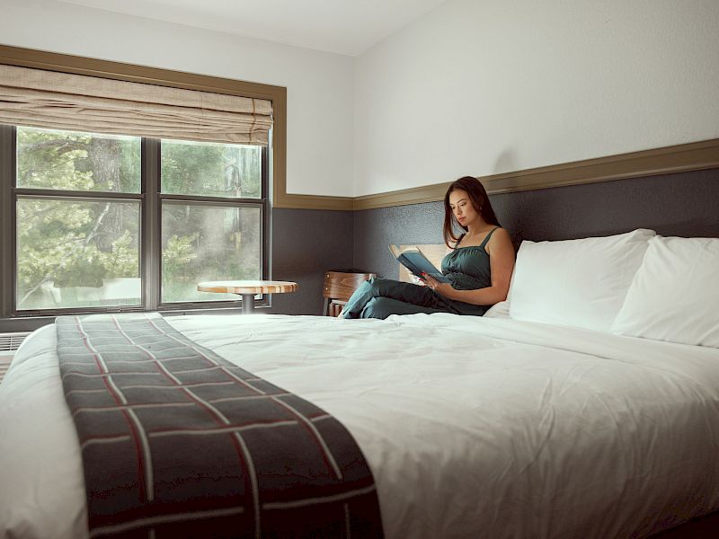 Female reading on bed